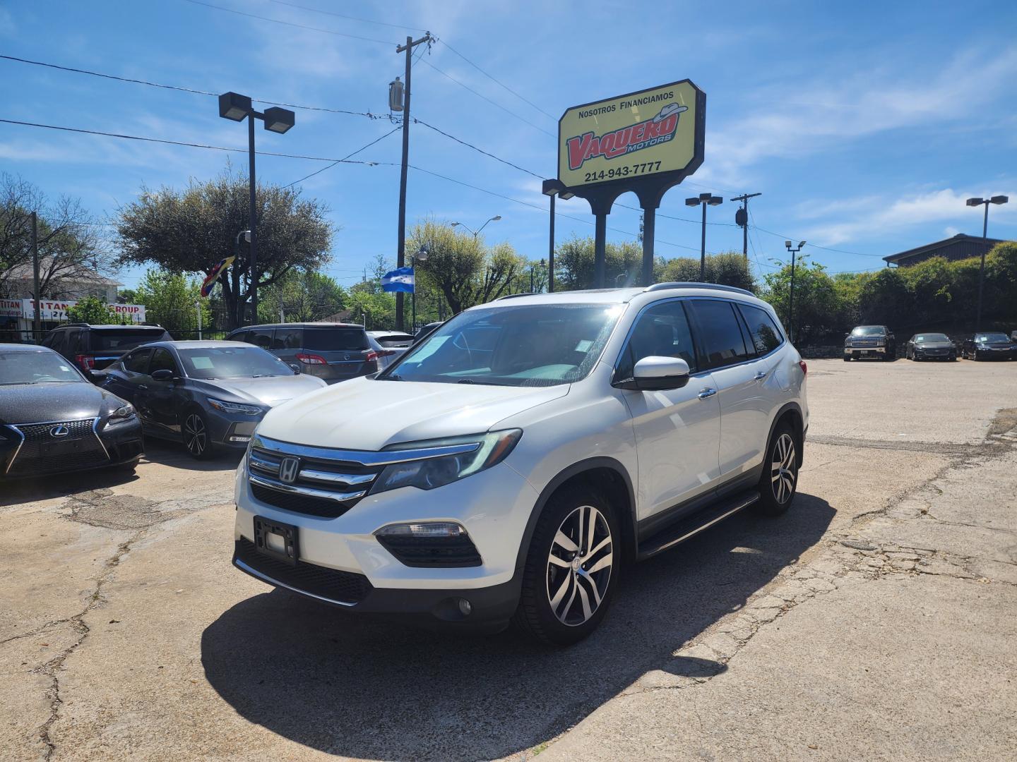 2016 white Honda Pilot Touring 2WD (5FNYF5H98GB) with an 3.5L V6 SOHC 24V engine, 9-Speed Automatic transmission, located at 945 E. Jefferson Blvd, Dallas, TX, 75203, (214) 943-7777, 32.752514, -96.811630 - Photo#0